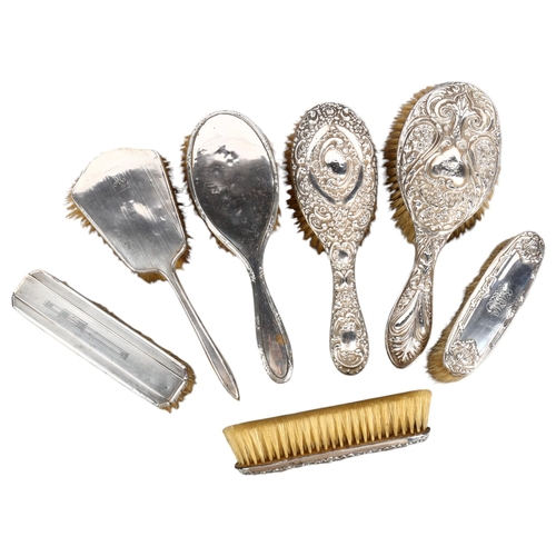 556 - 7 various embossed and engine turned silver-backed dressing table brushes