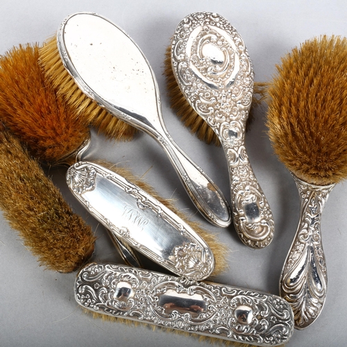 556 - 7 various embossed and engine turned silver-backed dressing table brushes