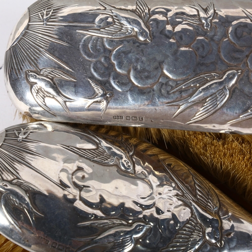 561 - 3 silver-backed brushes with swallow and swift embossed decoration