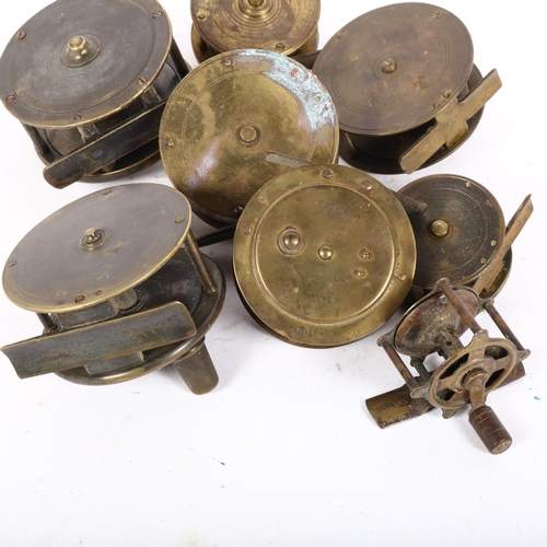 58 - A group of 8 Vintage brass salmon and other fishing reels (all unnamed)