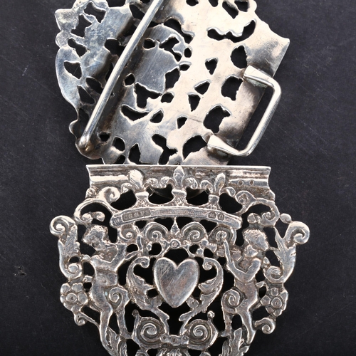 590 - A late Victorian silver nurse's buckle, Saunders & Shepherd, Chester 1897, pierced heart and cherub ... 