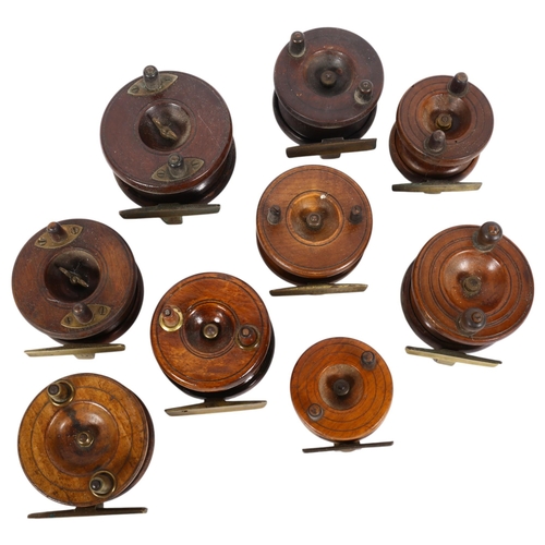 71 - A group of early 20th century wooden and brass-mounted fishing reels, including a 3