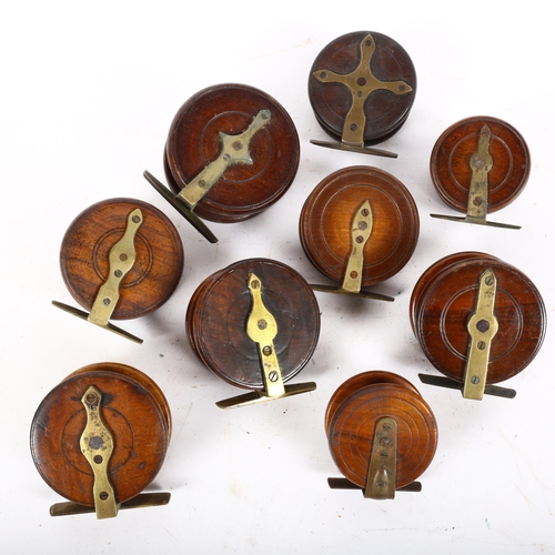 71 - A group of early 20th century wooden and brass-mounted fishing reels, including a 3