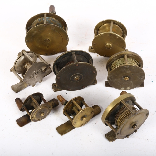 76 - A group of Vintage brass and other fishing reels, including 2 miniature examples (8)