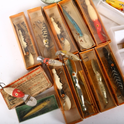 81 - A collection of various fishing spinners, river lures, including Bomber Bait Company Texas, and a co... 