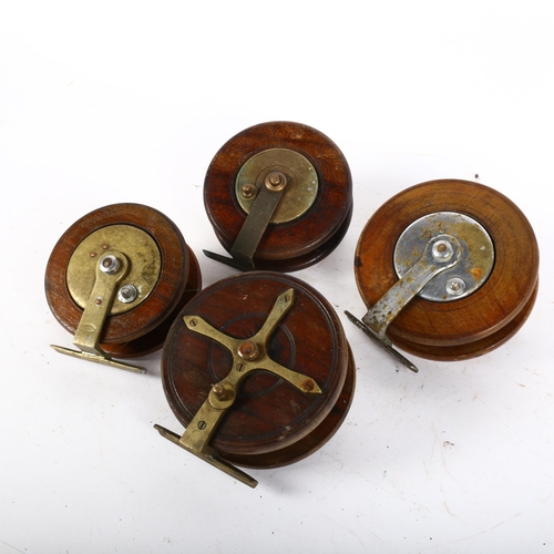 82 - 4 various Vintage teak fishing reels, including a brass star back example, largest 5.5