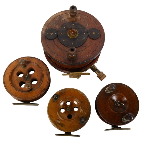 83 - A group of Vintage teak fishing reels, largest 8 and 1/4