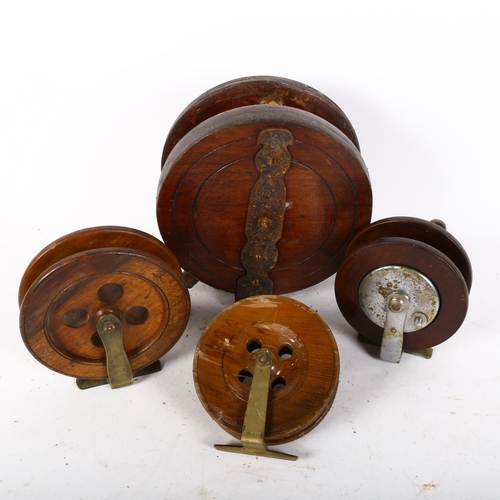 83 - A group of Vintage teak fishing reels, largest 8 and 1/4