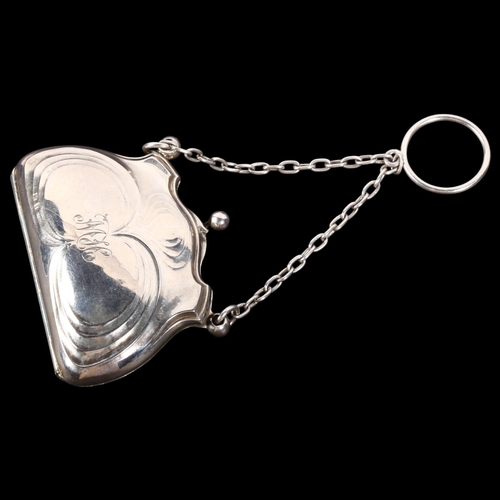 614 - An Art Nouveau embossed silver purse of small size, with monogram