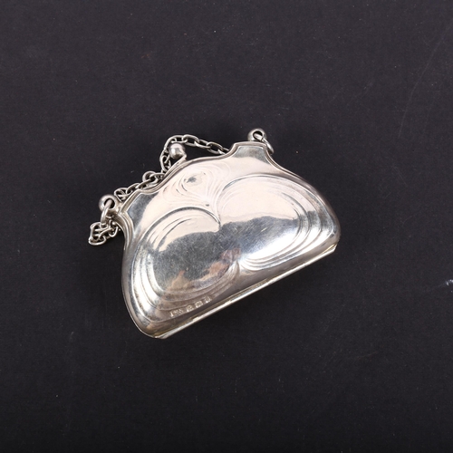 614 - An Art Nouveau embossed silver purse of small size, with monogram