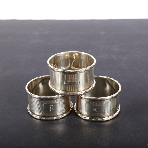 617 - 4 engine turned silver napkin rings, all monogramed R