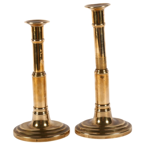 632 - A pair of brass telescopic candlesticks with oval bases, H22cm extended