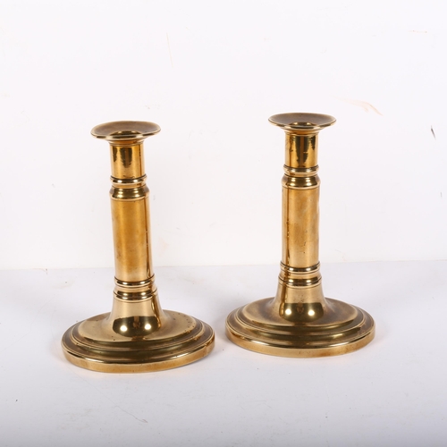 632 - A pair of brass telescopic candlesticks with oval bases, H22cm extended