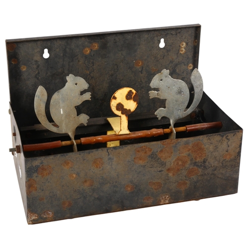 651 - An air gun target, modelled as squirrels in a metal container, 30cm across