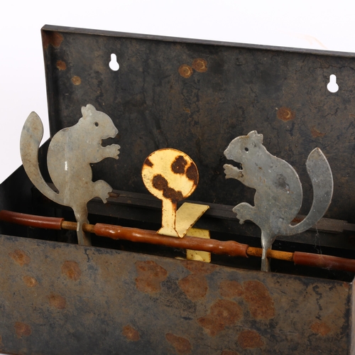 651 - An air gun target, modelled as squirrels in a metal container, 30cm across