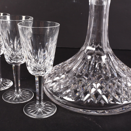 659 - A Waterford Crystal Lismore pattern ship's decanter and stopper, 26cm, boxed, and 6 matching Sherry/... 