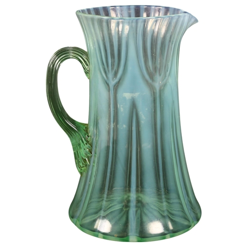 709 - An Art Nouveau vaseline glass jug, unmarked, possibly Powell Whitefriars, H17.5cm, from the estate o... 