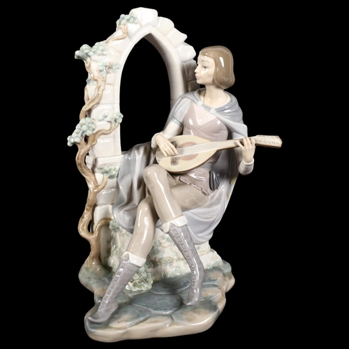 712 - A Lladro porcelain figurine depicting a minstrel seated in an archway, figure ref. no. 4927, H35cm