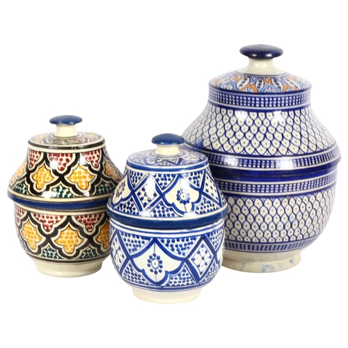 757 - A group of 3 Moroccan ceramic soup/casserole pots, various designs and coloured decoration, each wit... 