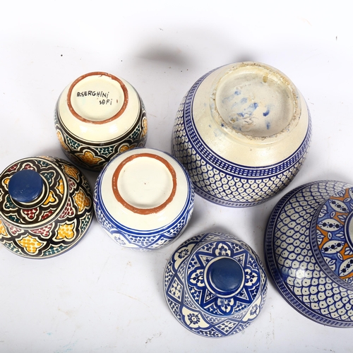 757 - A group of 3 Moroccan ceramic soup/casserole pots, various designs and coloured decoration, each wit... 