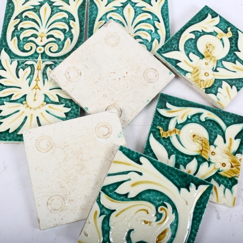 772 - A group of 8 Minton Hollins relief moulded tiles, in pale green and cream, each tile measures 15cm x... 