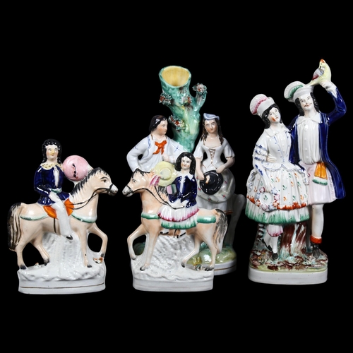 777 - A group of Staffordshire ceramic figures, including various figures on horseback, spill vases, etc (... 