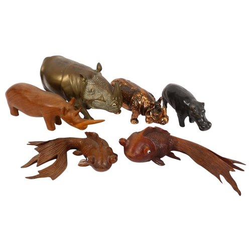 780 - A selection of carved wood and other animals, including 2 similar Koi fish and various rhino, larges... 