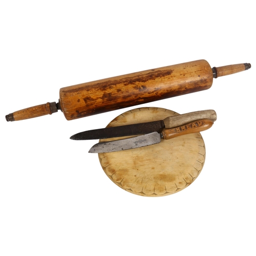 782 - A selection of Antique kitchenalia, including an oval hardwood breadboard, diameter 24.5cm, a substa... 