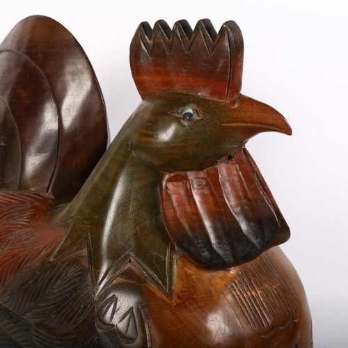 785 - A large carved hardwood sculpture of a rooster, unsigned, H50cm, L54cm, W25cm