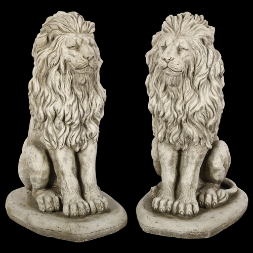 787 - A pair of concrete garden statues, seated Lions, height 40cm.