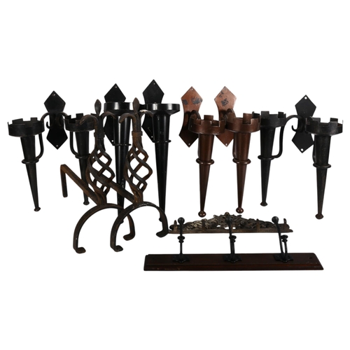 794 - A selection of Gothic style metal wall sconces, a pair of cast-iron fire dogs, etc