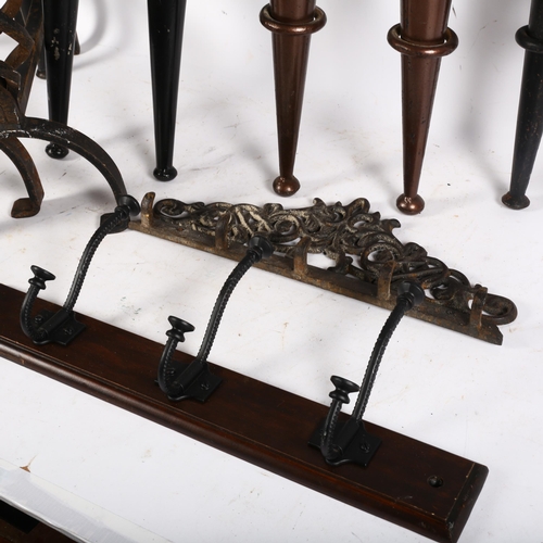 794 - A selection of Gothic style metal wall sconces, a pair of cast-iron fire dogs, etc