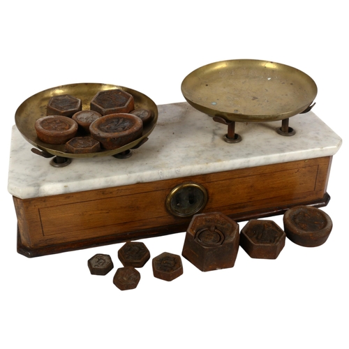 796 - A set of Antique apothecary balance scales, ornate marble top, brass scale dishes, and a selection o... 