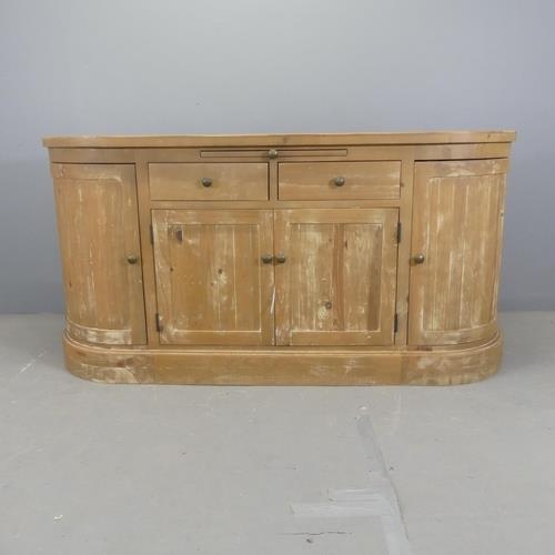 2505 - A modern pine bow-front sideboard. Width 175cm, height 86cm, depth 45cm.