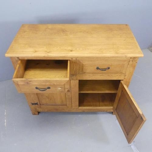 2514 - A modern light oak sideboard, with two drawers above two fielded panelled doors. Width 107cm, height... 