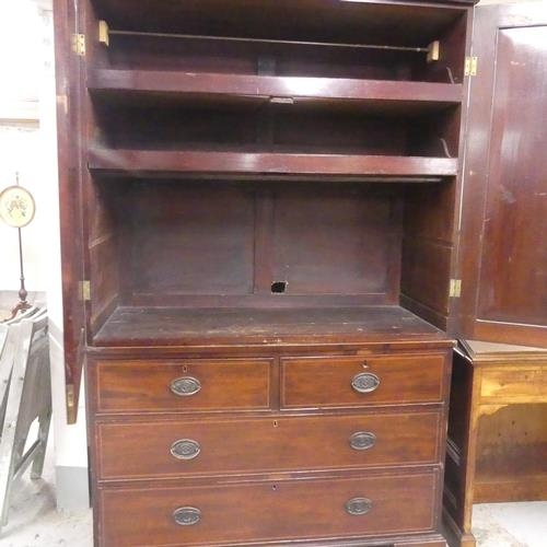 2518 - A 19th century mahogany three-section linen press, with slide fitted interior and two short and two ... 