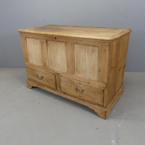 2530 - An antique panelled pint mule chest, with lifting top, two drawers and bracket feet. Width 118cm, he... 