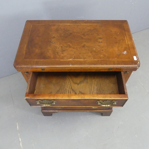 2549 - A Georgian style oak and mahogany bachelor's chest of four drawers, with walnut veneered foldover to... 