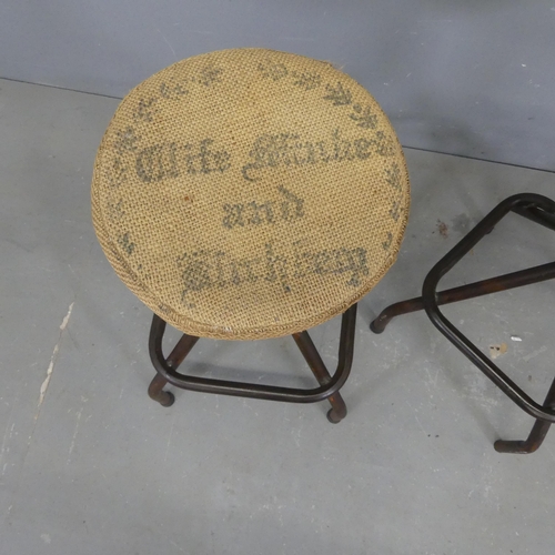 2559 - A pair of industrial machinist's style stools, with hessian upholstered seats on tubular metal base ... 