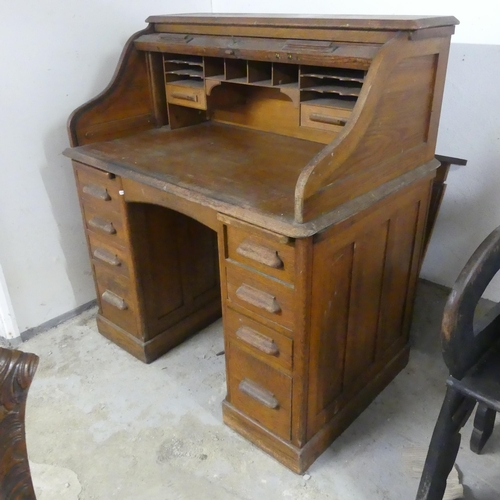 2560 - A 1930s oak tambour front writing desk. Width 106cm, height 118cm, depth 70cm.