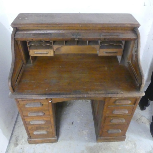 2560 - A 1930s oak tambour front writing desk. Width 106cm, height 118cm, depth 70cm.