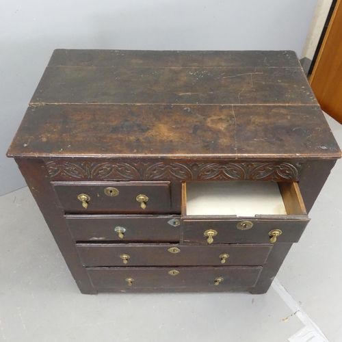 2578 - A 17th century and later oak chest of two short and three long drawers, with carved decoration, bras... 