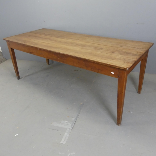 2583 - A French cherrywood plank top dining table, raised on square tapered legs. Length 197cm, height 72cm... 