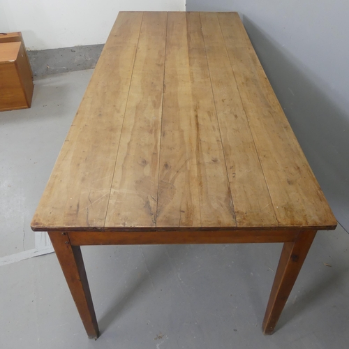 2583 - A French cherrywood plank top dining table, raised on square tapered legs. Length 197cm, height 72cm... 