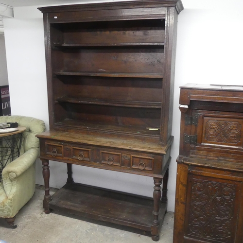 2591 - A 19th century two-section oak dresser, the upper section shelved, the lower with two drawers and po... 