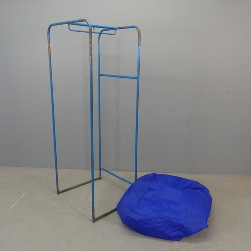 2654 - A vintage painted tubular metal shop display rack, with waterproof cover. Width 54cm, height 137cm, ... 