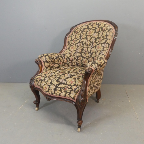 2673 - A Victorian mahogany and upholstered parlour arm chair.