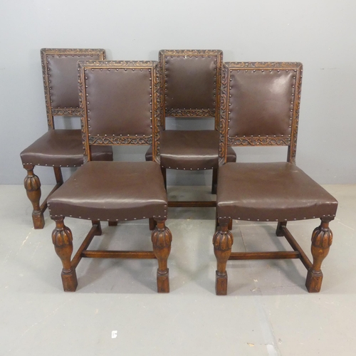 2676 - A set of four 1920s oak and studded faux-leather upholstered dining chairs with carved decoration.