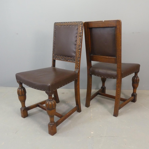 2676 - A set of four 1920s oak and studded faux-leather upholstered dining chairs with carved decoration.