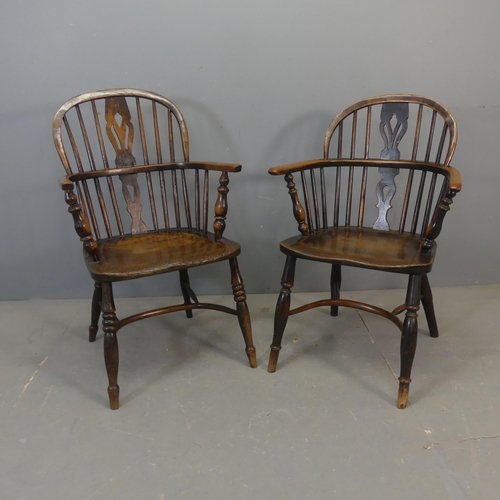 2679 - Two similar 19th century oak comb-back Windsor elbow chairs with crinoline stretchers.